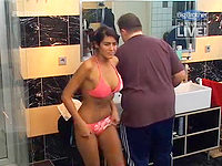 The sweet bimbo in the pink bikini panty and bra is taking the hot shower.